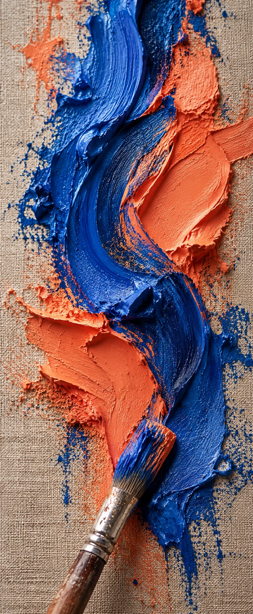 A vertical close view of cobalt and coral textured paint